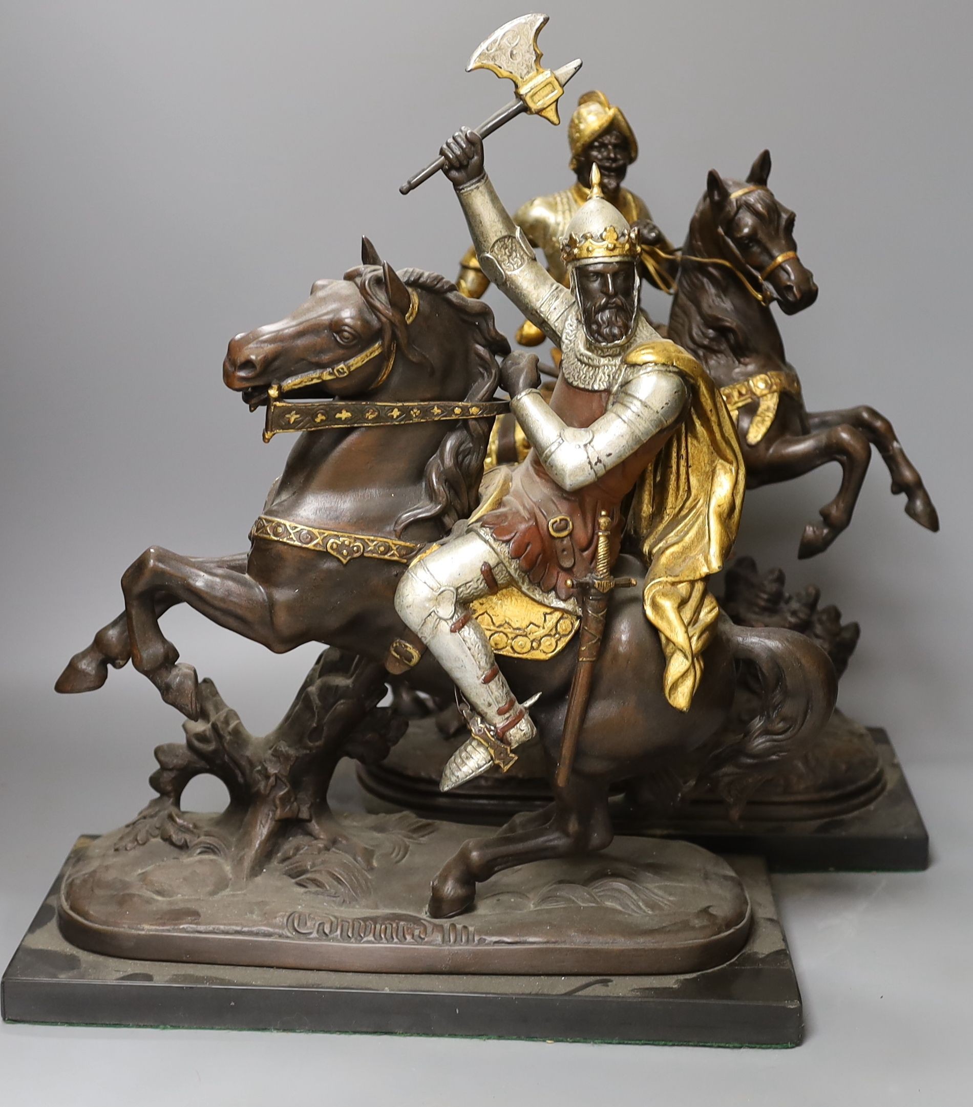 Three spelter warriors on horseback - tallest 43cm